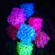 A stack of fluorescent gyroids.